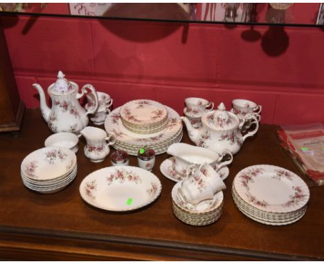 A Royal Albert 'Lavender Rose' pattern dinner service comprising eight dinner plates, eight dessert plates, eight side plates