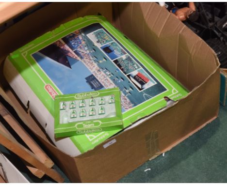 A box containing vintage Subbeteo table football