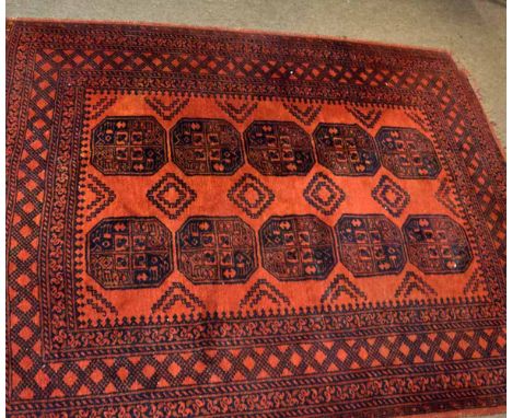 Good quality Bokhara type carpet in a rust field with repeating lozenge centre on a multi-gulled border, 57cms wide x 205cms 
