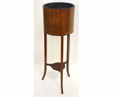 Edwardian mahogany circular planter with open top, fitted with a toleware inner, supported on three tapering square legs, 33c