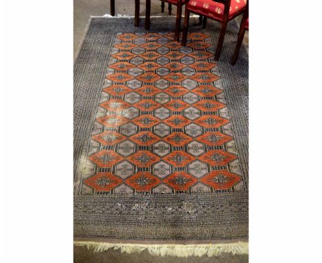 Good quality grey and rust Bokhara type carpet with multi-gulled border (a/f), 164cms wide x 248cms long  