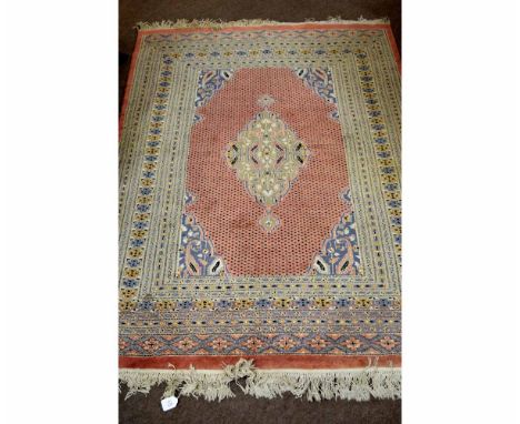 Modern Persian type carpet with a puce centre and cream multi-gulled border, with central diamond lozenge, 131cms wide x 190c