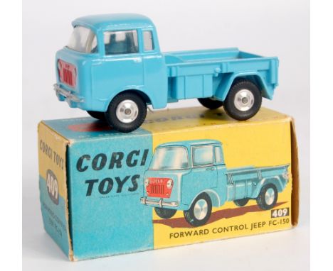 Corgi Toys, 409 forward control Jeep, light blue body with red grille, shaped hubs, in the original blue and yellow all-card 