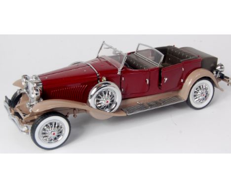 Franklin Mint 1/24th scale diecast model of a 1930 Duesenberg J Derham tourster, finished in maroon and light brown, with chr