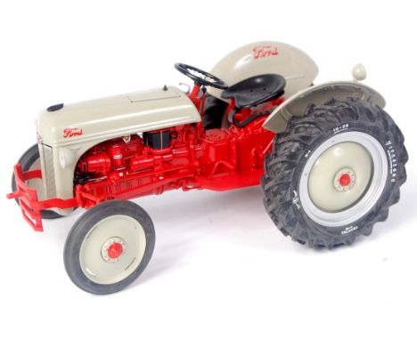 Danbury Mint, 1/16th scale diecast model of the 1952 Ford 8N tractor, finished in grey and red, in the original box with rela