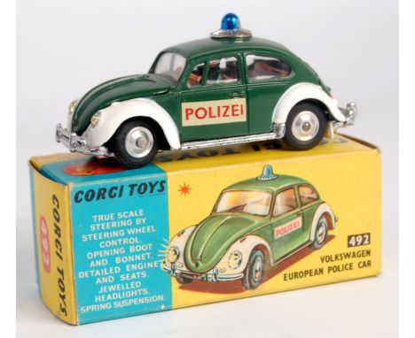 Corgi Toys, 492 Volkswagen European police car, dark green body with white wings and jewelled headlights, spun hubs with Poli