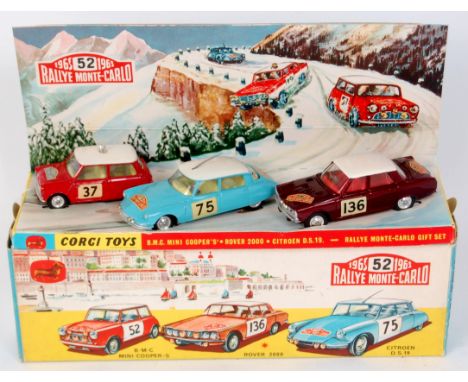 Corgi, gift set No.38, BMC Mini Cooper 317, red RN37 322 Rover metallic maroon RN136, 323 Citroen DS19, pale blue RN75, all o