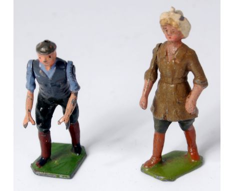Britains, lead figures, man to push lawn mower and pre war land army girl (x 2) (VG-NM)