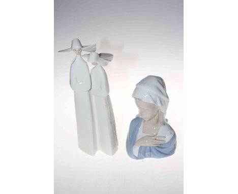 Collection of seven Lladro and two Nao figures including Madonna, Nuns and sleeping cherub (9).Condition: Angel praying has c