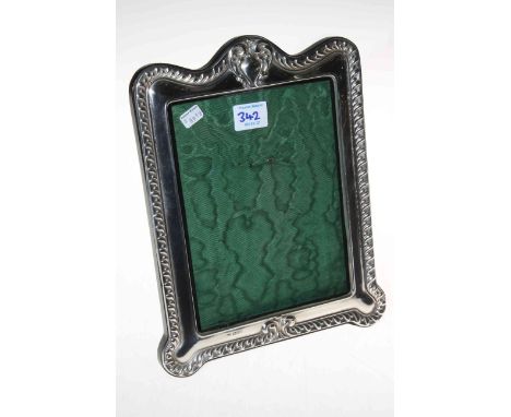Silver mounted easel photograph frame, hallmarked Chester 1908, overall 28.5cm by 22.5cm. CONDITION - There are two pierce sp