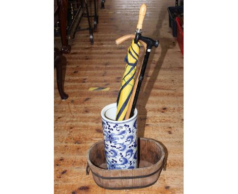 Oriental blue and white stick stand, brolly and two sticks together with a coopered oval planter.