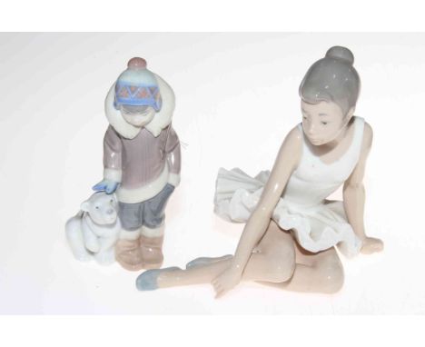 Lladro Eskimo boy with bear cub, 15cm, and Nao ballerina resting.Condition: Both Good.