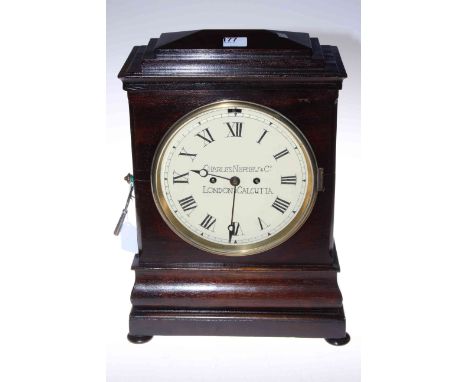 Charles Nephew &amp; Co., London and Calcutta mahogany cased bracket clock with enamel dial and double fusee movement, 29 by 