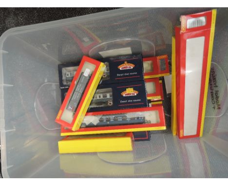 Sixteen Hornby and Bachmann 00 gauge carriages, coaches and wagons, all boxed