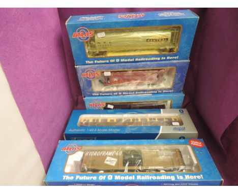 Four 0 gauge Atlas wagons, GATX Airslide Covered Hopper, USRA Box Car, NYC 3-Bay Central Hopper and Ps-a Box Car all boxed al