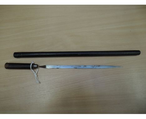 A black leather covered swagger stick dagger, possibly World War I officers, with 11inch blade