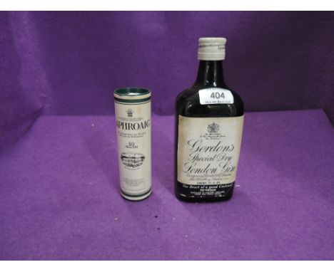 A bottle of Gordon's Special Dry London Gin 13 1/3Fl Ozs 70% proof and a miniature bottle of 10year old Laphroaig Whisky