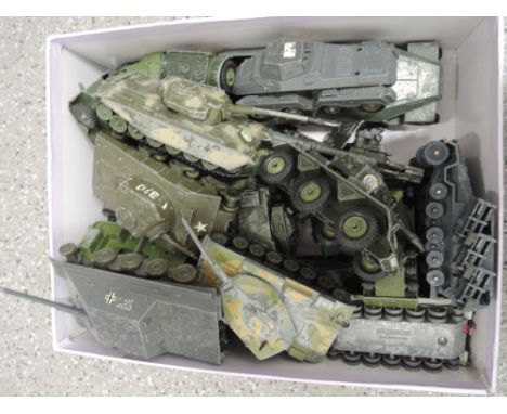A collection of Corgi, Dinky, Solido and similar playworn military vehicles