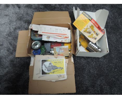 A Meccano Steam Engine along with many extra parts, accessories and instruction booklets