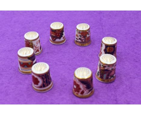 A collection of eight Royal Crown Derby Thimbles including Derby Old Japan and Derby Garden 