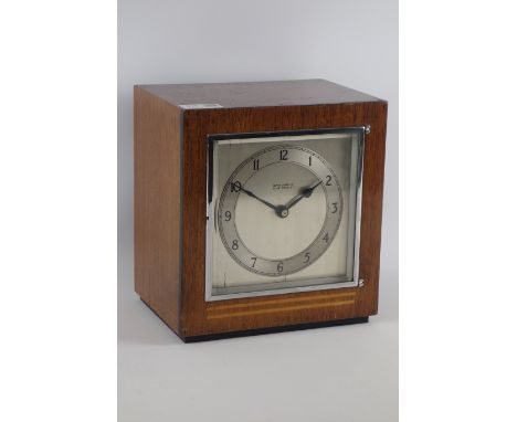 Art Deco period walnut cased mantle clock, silvered dial signed 'Mappin & Webb', enclosed by chromed bezel and bevelled glass