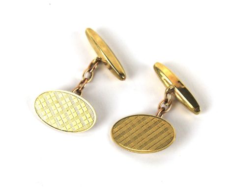 A pair of gents 9ct gold cufflinks. Each with oval section with engine turned decoration, combined weight approximately 4.8g