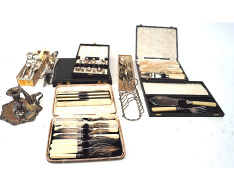 A large quantity of silver plated flatware. Including a carving set, chamber stick and more, some in the original boxes