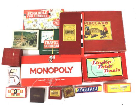 An assortment of vintage children's games. Including a boxed Meccano no.5 part set, dominoes, jigsaw puzzles etc