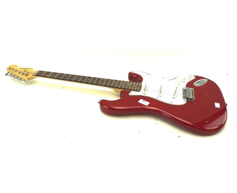 A Chantry electric guitar in red and white and an amplifier G-10.