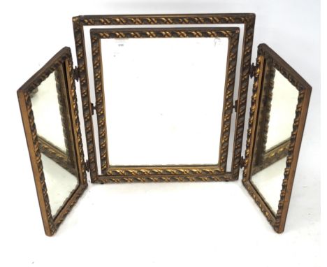 A gilt decorated tryptic mirror with rope twist decoration to the frame.