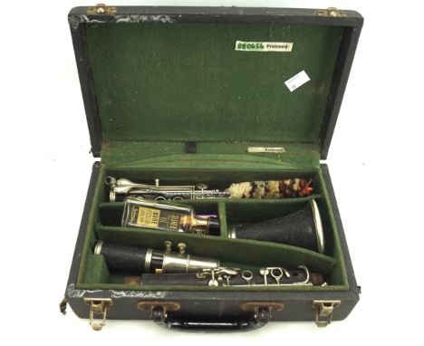 A Pridmore ebony clarinet. In the original fitted box, together with cleaning equipment Condition Report: No name on the clar