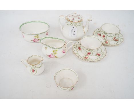 A Royal Doulton Tea set for two. Comprising, two cups and saucers, teapot, milk jug, sugar bowl, creamer and strawberry bowl