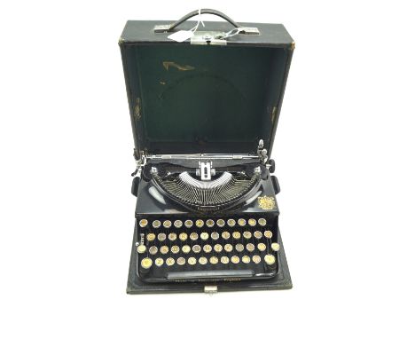 A vintage Imperial typewriter. In black with the original carry case