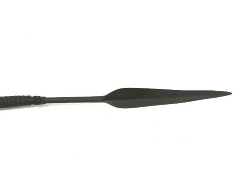 A tribal spear and a walking stick. The spear with leather bindings and a fur handle, L133cm, the walking stick with a horn h