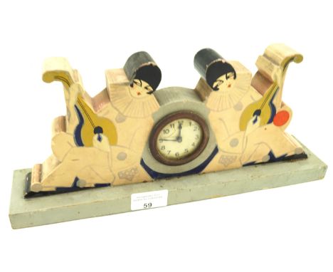 An Art Deco French painted wooden mantle clock. The circular dial with Arabic numerals denoting hours, flanked by painted jes