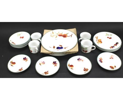 A part Royal Worcester 'Evesham Vale' service decorated with autumn fruits. Including dinner and side plates, bowls and cups 