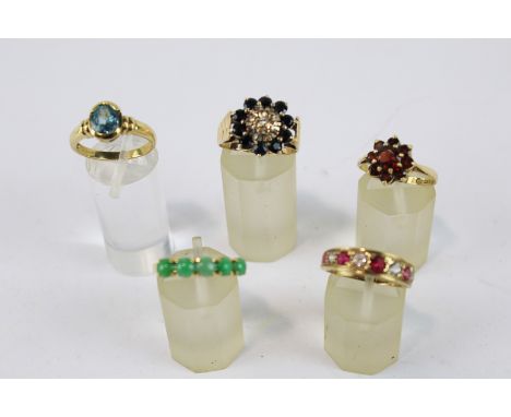 A jadeite five stone ring and four vintage 9ct gold and gem rings; The round cabochon jadeite five stone ring on a 'D' sectio