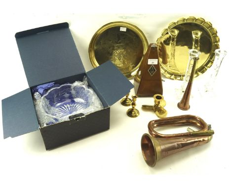 An assortment of collectables. Including a metronome, pairs of brass and glass candlesticks, copper trumpet etc