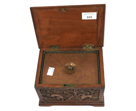 A 20th century tea caddy. The wooden exterior carved with animals and flowers, containing a single compartment with a metal l