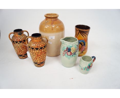 An assortment of ceramics. Including a Poole Pottery vase with an Aegean impressed mark, a pair of twin handled pebble vases 