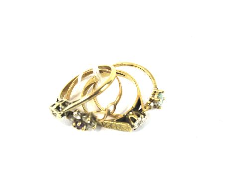 Four vintage 9ct gold ladies' rings. Including three gem set examples, 5.7g