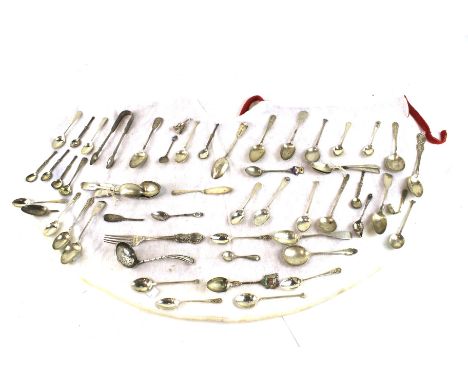 A large assortment of silver and silver plated flatware. To include sugar sifter spoon, Victorian silver fork and teaspoons a