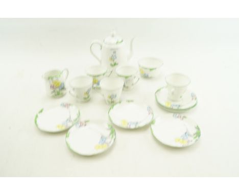 A Heathcote porcelain Art Deco part coffee service. Comprising a coffee pot, five cups, six saucers, a cream jug and a sugar 
