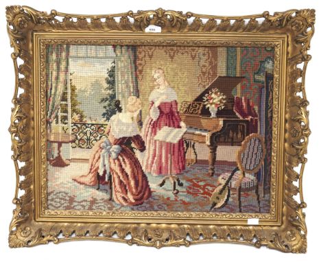 A 20th century needlework tapestry. Depicting two ladies in period dress, mounted in pierced gilt frame, 54cm x 40cm