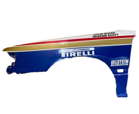 With the names of Colin McRae and Graham Scott (motoring journalist) on the top of the wing.&nbsp;&nbsp;This bodywork was rem