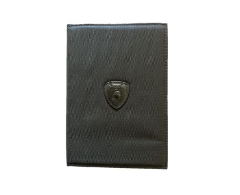Presented in leather, Lamborghini shield-embossed wallet with Owner's Handbook and 'Multimedia System Instructions for Use' M