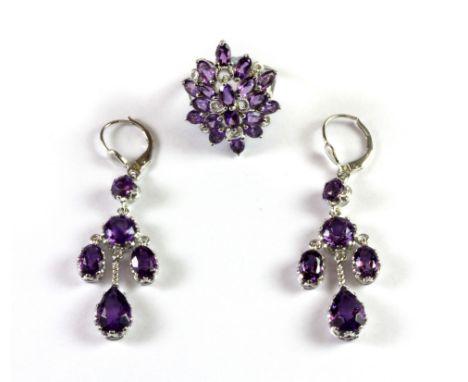 A white metal (tested silver) amethyst set ring (L) together with a pair of white metal (tested silver) amethyst drop earring