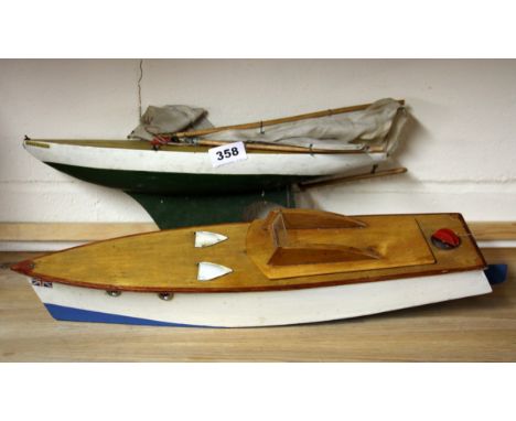 A vintage wooden pond yacht and motor cruiser.