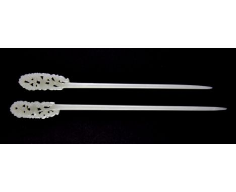 A pair of 19th / early 20th century Chinese carved nephrite jade hair pins, L. 19 & 17cm.