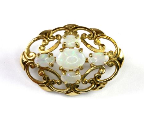 A 9ct yellow gold (stamped 375) opal set brooch, L. 2.5cm.